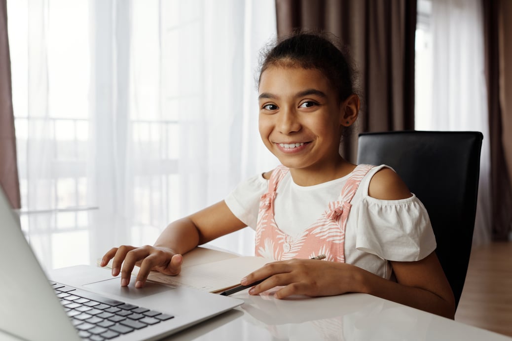young-girl-using-a-laptop-4260479